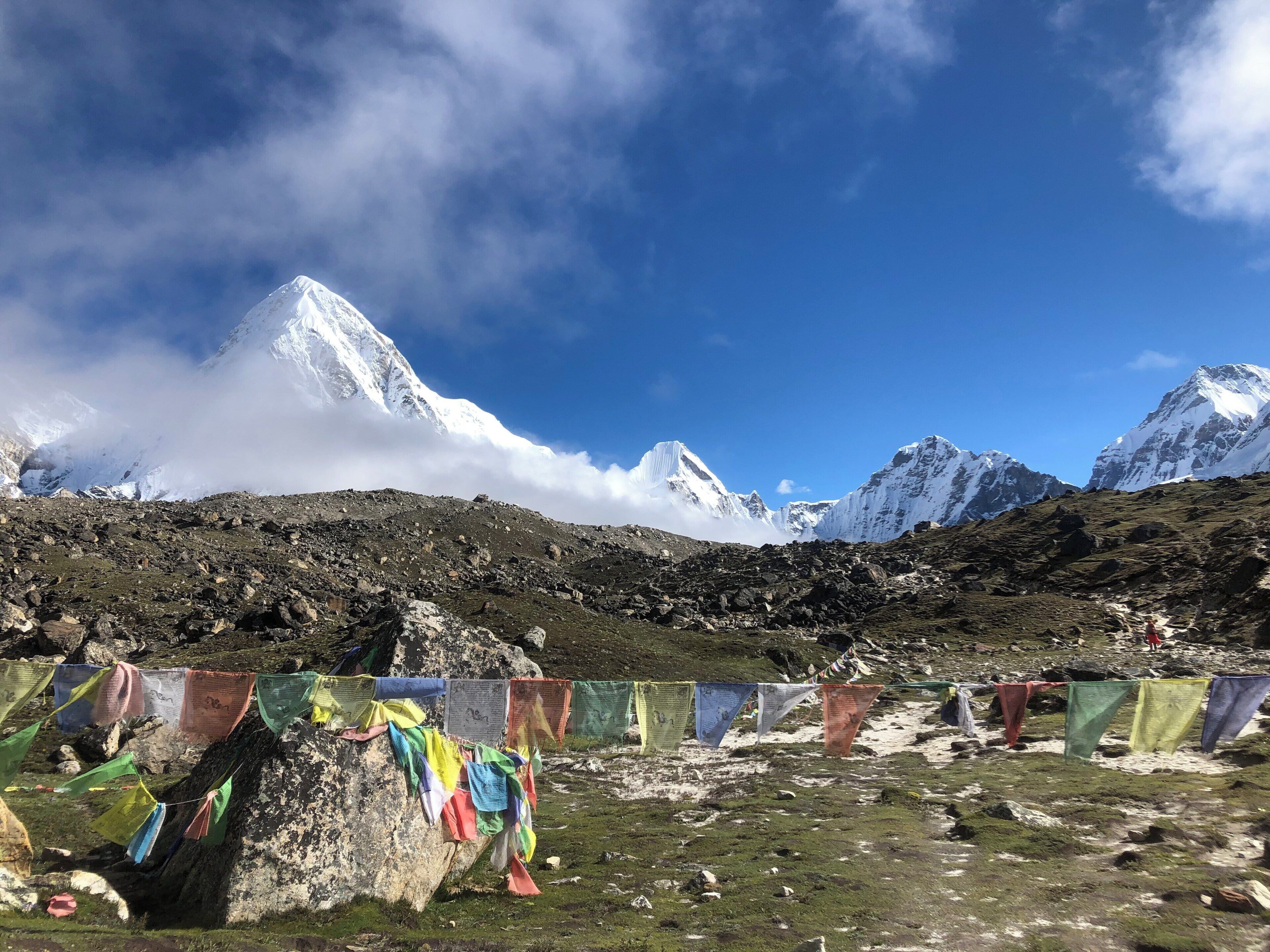A snow-capped mountain range under a clear blue sky.
