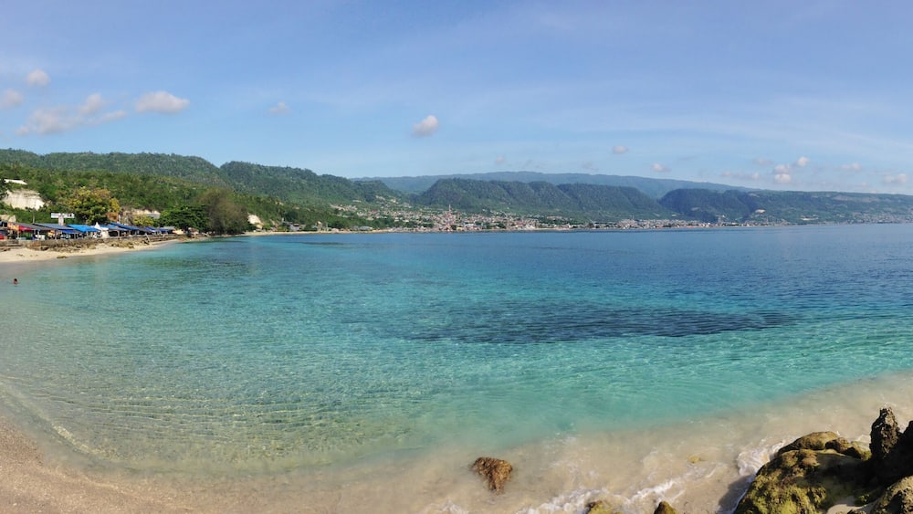 view of the sea and mountains. Beautiful view at Kilo Lima Beach Luwuk Central Sulawesi Indonesia