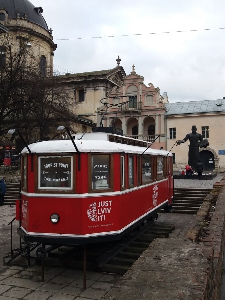With the monument to Ivan Fedorov in the background