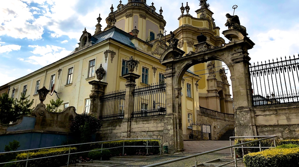 Located on St. George Hill, over-looking the city of Lviv, the church was the perfect target for destruction in the past. At least two versions of the St. George Cathedral were built before the final construction of the church as it is seen today. The Cathedral of St. George became the mother congregation of the Greek-Catholic religion in Ukraine.
The St. George Cathedral in Lviv, is home to one of the most treasured relics, which was brought to the cathedral by Bishop Jiseph Shumlianskyi in 1674. It is the Icon of the Virgin Mary, and is a spectacular and preserved artifact. The interior was decorated with luxurious embellishments created by the local artistic talents of Lviv. Pinsel, the sculptor of the cathedral, created the spectacular St. George (known as the Dragon Slayer) statue. The St. George statue can be viewed in the attic of the cathedral, while the intimidating statues of St. Athanasius and St. Leo protect the portal.
Renovations to the St. George Cathedral took place in the 1996, restoring the original beauty of the cathedral. Tourists, visiting this amazing historical masterpiece will not be disappointed. Over and above the cathedral, visitors can also visit the belfry, walk through the peaceful gardens or enter the final resting place of many important figures of the past in the tombs below the cathedral.