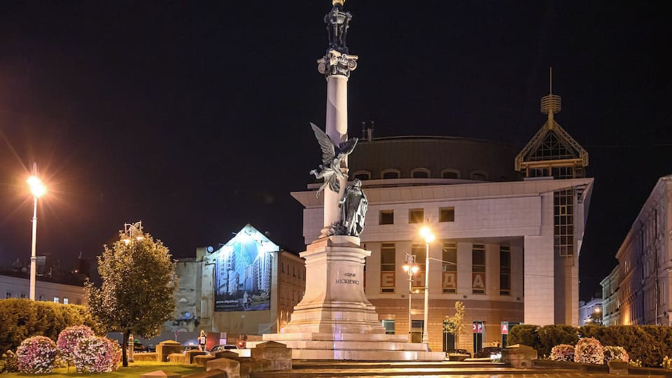 The column of Adam Mickiewicz is a historical and cultural attraction of the central part of Lviv, located in the square named after the poet. The height of the monument is 21 meters, the figures of Miscavige are 3.3 meters. Flames on the top of the column are gilded