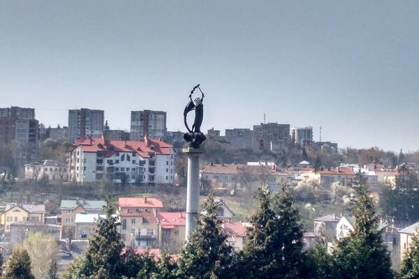An Angel rises over Lychakiv Cemetery and the ancient town of Lviv in the West of Ukraine.