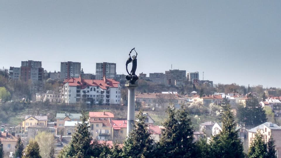 An Angel rises over Lychakiv Cemetery and the ancient town of Lviv in the West of Ukraine.