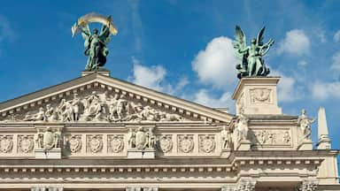 A neoclassical building with ornate sculptures and a central pediment.