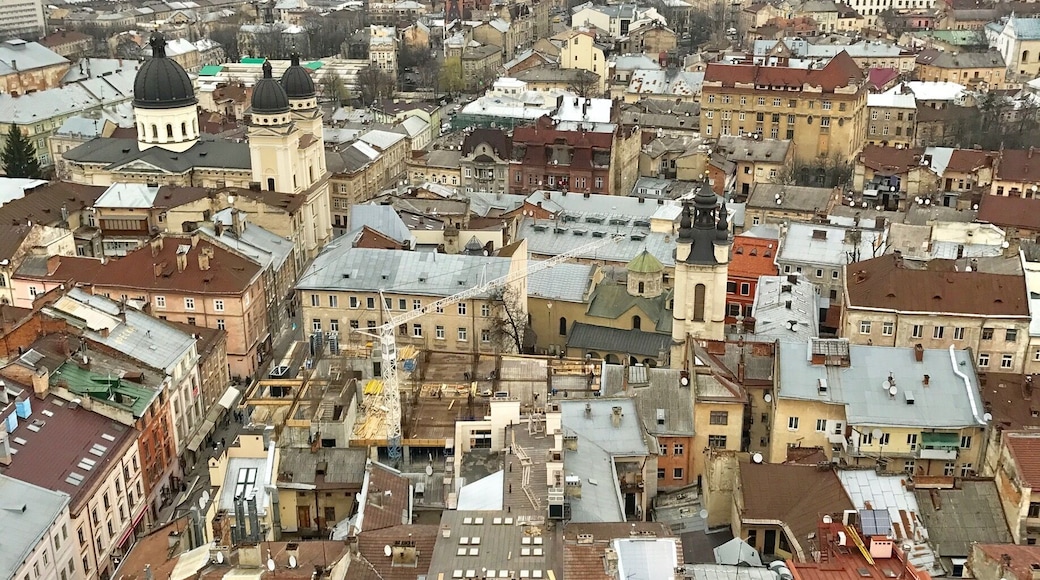 Lviv, Ukraine. Very European and Russian. Pay a small fee and climb 409 stairs in the bell tower for this lovely view.