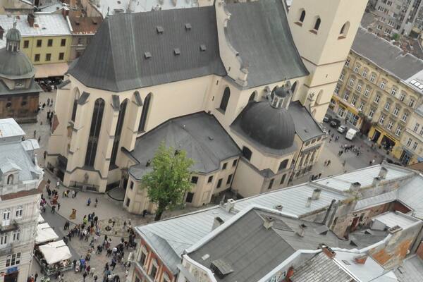 Lovely view of old Lviv from the top of the tower in the center of Ploscha Rynok. That's the Latin Cathedral, one of the oldest still-active churches in the city. To climb the tower, go up the first four flights of stairs to the ticket desk. The way is clearly marked with signs in multiple languages, including English. At the desk, pay 10 hrivna and then keep climbing up, up, and up until you reach the open deck at the top of the tower. Then enjoy the view!