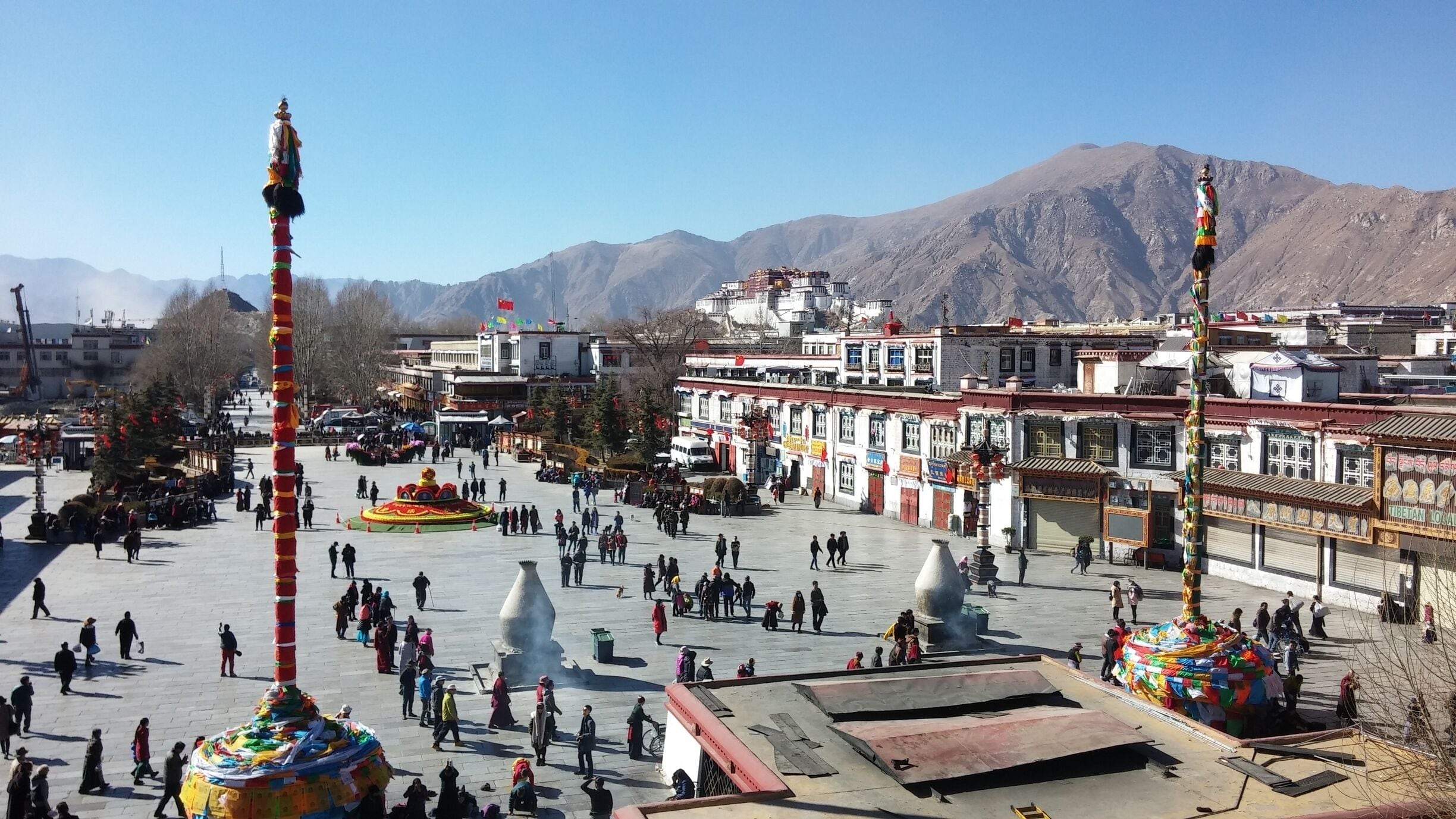 View from stop Jokhang Temple of Potala Palace in the distance and Barkhor Street below.