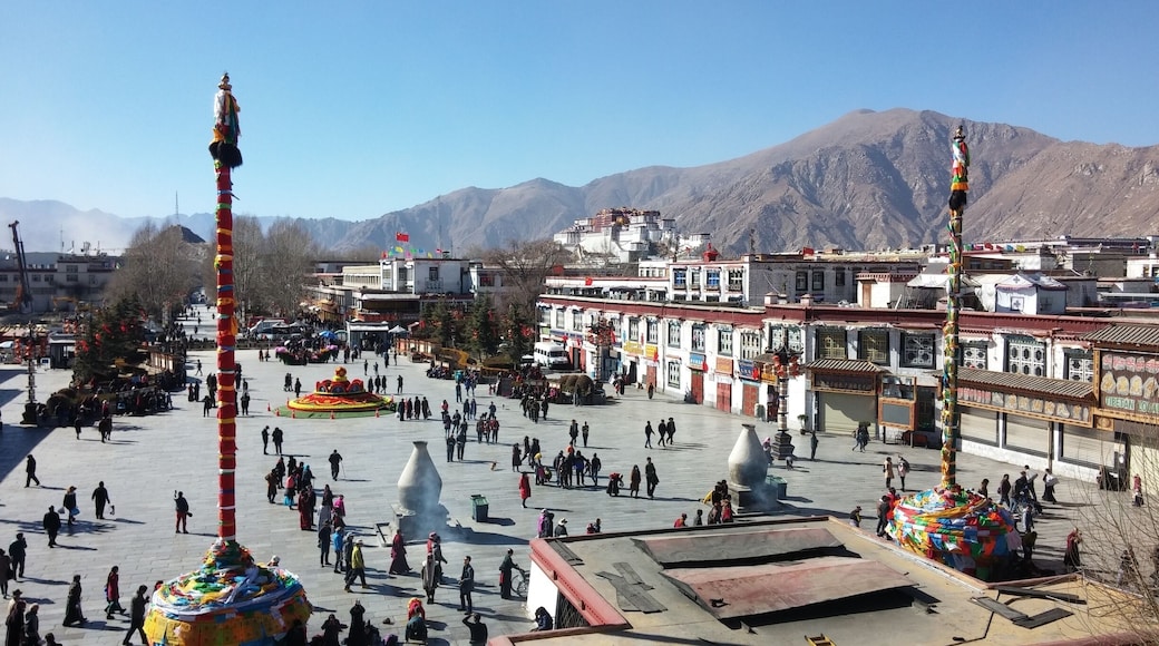 View from stop Jokhang Temple of Potala Palace in the distance and Barkhor Street below.