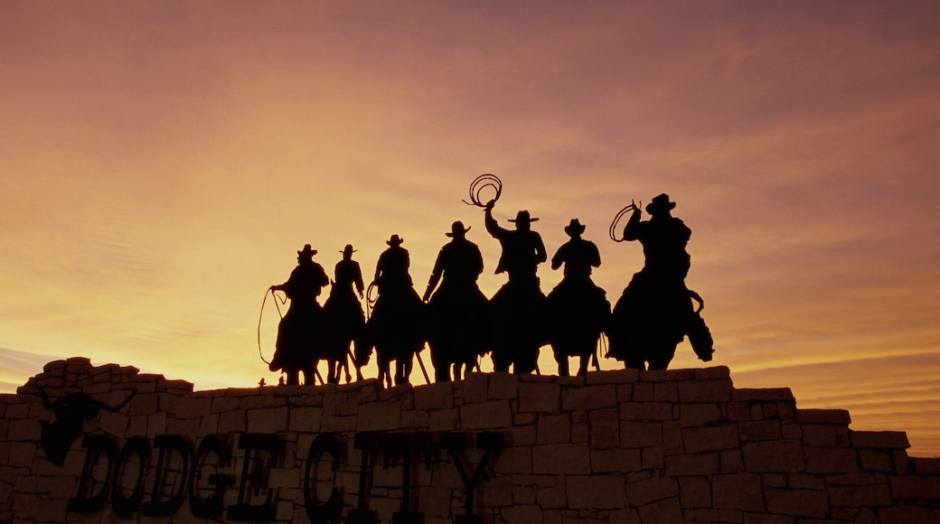 Kansas which includes a statue or sculpture, a sunset and outdoor art