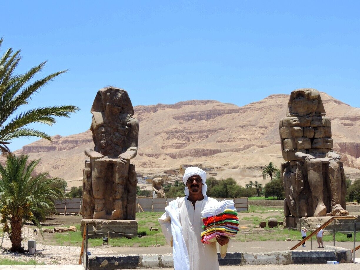 Talk about persistence! The Egyptian sales men know how to get you to buy something - just stand in the way of your picture perfect shots! Little did this man know that he was a perfect third statue in this shot.