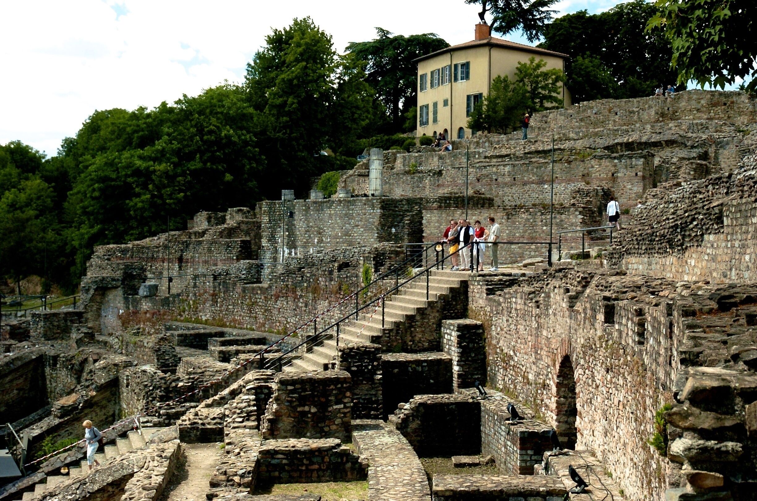 The Ancient Theatre of Fourvière is a Roman theatre in Lyon, France. It was built on the hill of Fourvière, which is located in the center of the Roman city.

The theatre was built in two steps: around 15 BC, a theatre with a 90 m diameter was built next to the hill. At the beginning of the 2nd century, the final construction added a last place for the audience.

The oldest Roman theater in France, Lyon’s Ancient Theatre of Fourvière was built under the orders of Augustus and expanded in Hadrian’s time. Completed in 17 B.C. with space for 10,000 people, today the Grand Theatre is part of the UNESCO World Heritage site of Lyon. 
