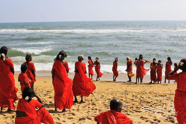 I was sitting on the beach looking out at the Bay of Bengal. It was gorgeous; wide, open ocean.
Suddenly, ever so quietly, these pilgrims adorned in red, passed by me one by one, heading towards the same water I was just looking out at.
IT WAS AMAZING.