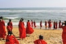 I was sitting on the beach looking out at the Bay of Bengal. It was gorgeous; wide, open ocean.
Suddenly, ever so quietly, these pilgrims adorned in red, passed by me one by one, heading towards the same water I was just looking out at.
IT WAS AMAZING.