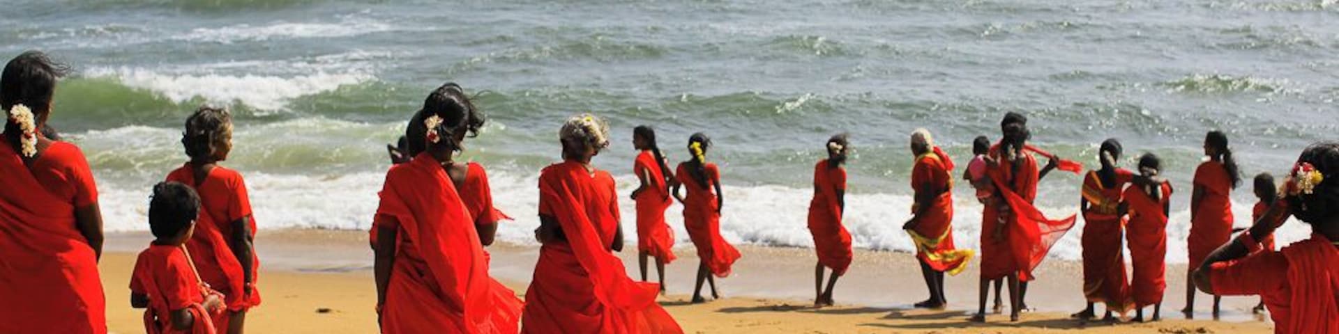 I was sitting on the beach looking out at the Bay of Bengal. It was gorgeous; wide, open ocean.
Suddenly, ever so quietly, these pilgrims adorned in red, passed by me one by one, heading towards the same water I was just looking out at.
IT WAS AMAZING.