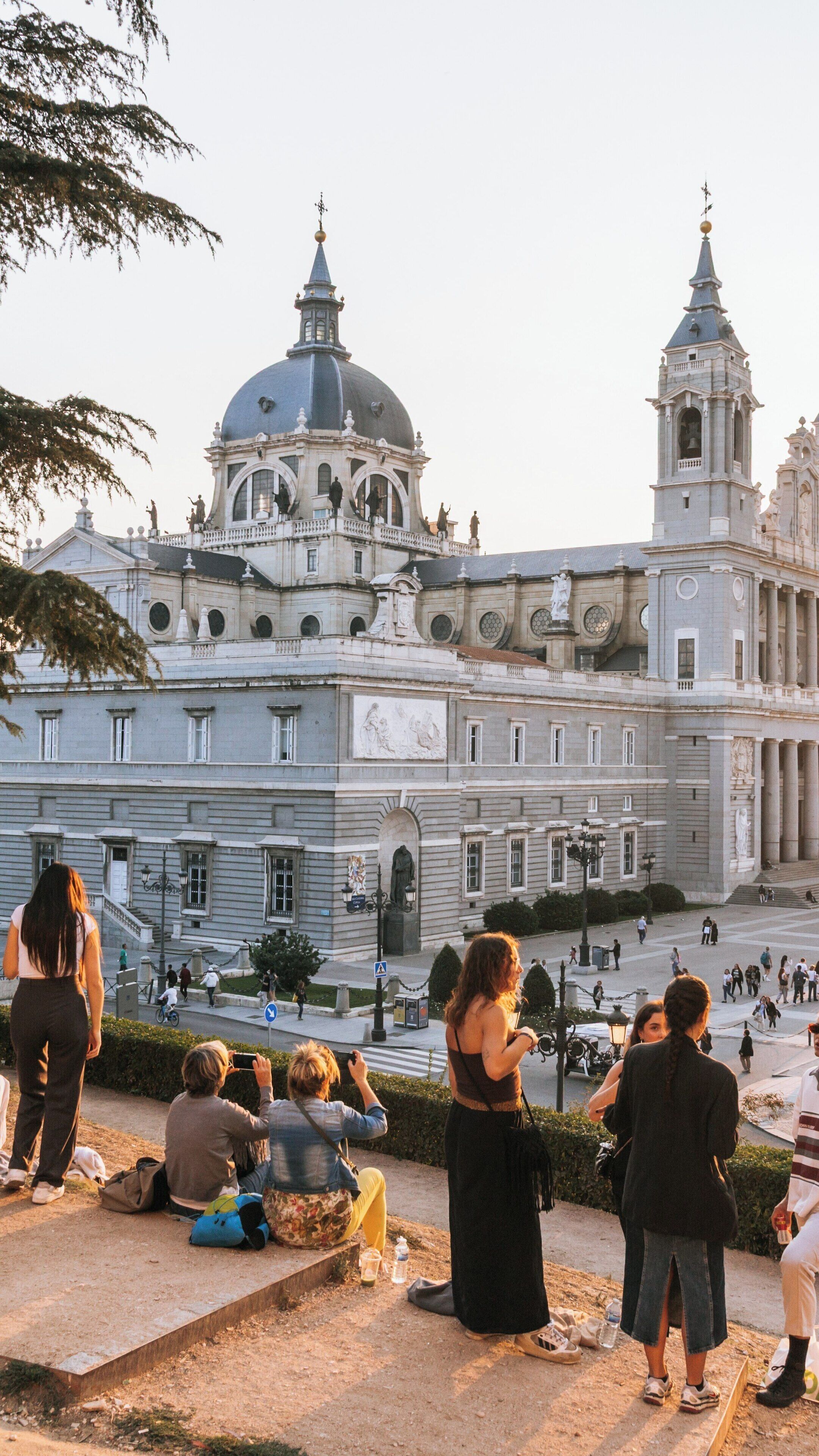 Guests enjoy evening views near Puerta de Toledo in Arganzuela Madrid, capturing the charm of Spanish architecture and lively atmosphere
