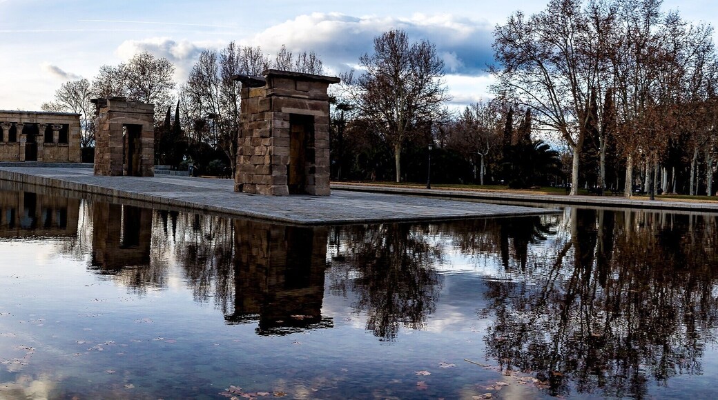 During my visit to Madrid I visited of course the Temple of Debod. It's fascinating to find a original Egyptian Temple outside of Egypt.
According to Wikipedia and the guide this is what happend and some information about the temple.
The Temple of Debod (Spanish: Templo de Debod) is an ancient Egyptian temple that was dismantled and rebuilt in Madrid, Spain.
Temple of Debod in Egypt before relocation to Spain.The shrine was originally erected 15 kilometres south of Aswan in Upper Egypt, very close to the first cataract of the Nile and to the great religious center in Philae dedicated to the goddess Isis. In the early 2nd century BC, Adikhalamani (Tabriqo), the Kushite king of Meroë, started its construction by building a small single-room chapel dedicated to the god Amun. It was built and decorated in a similar design to the later Meroitic chapel on which the Temple of Dakka is based. Later, during the reigns of Ptolemy VI, Ptolemy VIII, and Ptolemy XII of the Ptolemaic dynasty, it was extended on all four sides to form a small temple, 12 by 15 metres (39 ft × 49 ft), which was dedicated to Isis of Philae. The Roman emperors Augustus and Tiberius completed its decorations.
From the quay, there is a long processional way leading to the stone-built enclosure wall, through three stone pylon gateways, and finally to the temple itself. The pronaos, which had four columns with composite capitals, collapsed in 1868 and is now lost. Behind it lay the original sanctuary of Amun, the offering table room and a later sanctuary with several side-rooms and stairs to the roof.
The current Temple of Debod in Madrid.
In 1960, due to the construction of the Aswan High Dam and the consequent threat posed by its reservoir to numerous monuments and archeological sites, UNESCO made an international call to save this rich historical legacy. As a sign of gratitude for the help provided by Spain in saving the Abu Simbel temples, the Egyptian state donated the temple of Debod to Spain in 1968.
The temple was rebuilt in one of Madrid's parks, the Parque del Oeste, near the Royal Palace of Madrid, and opened to the public in 1972. The reassembled gateways have been placed in a different order than when originally erected. Compared to a photo of the original site, the gateway topped by a serpent-flanked sun was not the closest gateway to the temple proper. It constitutes one of the few works of ancient Egyptian architecture that can be seen outside Egypt and the only one of its kind in Spain.