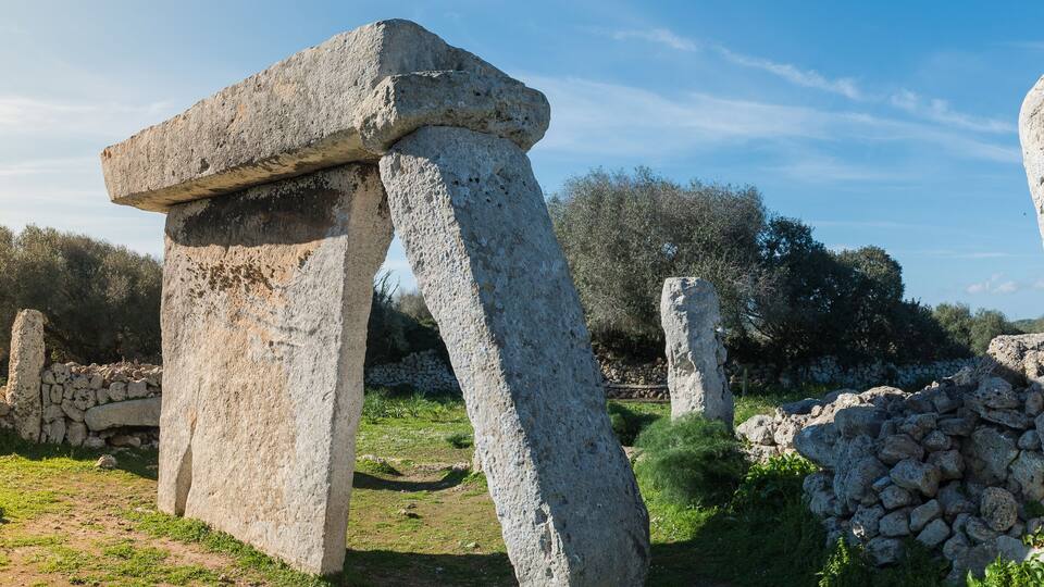 Ancient stone structures in a rural setting.