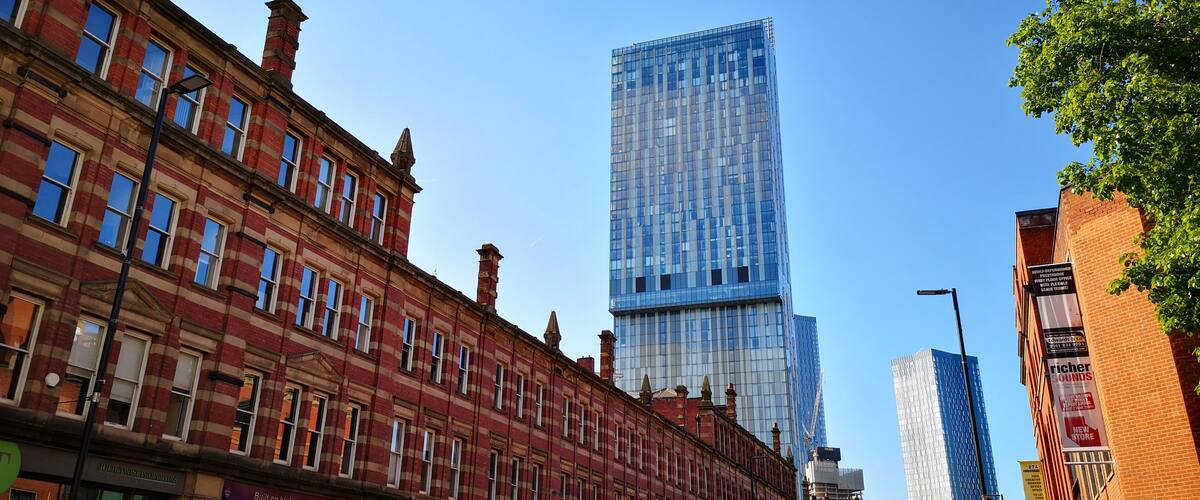 Beetham Tower ( the Hilton hotel) rising above candy-striped older buildings in Manchester. Love the contrasts!