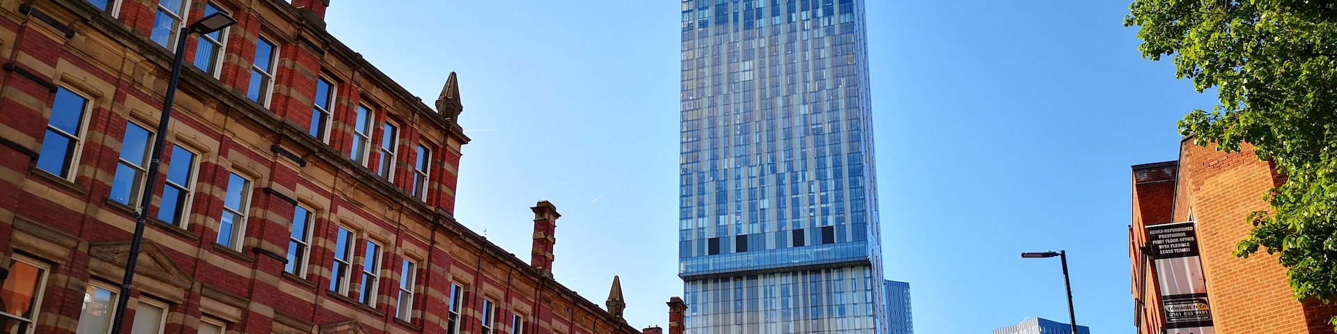 Beetham Tower ( the Hilton hotel) rising above candy-striped older buildings in Manchester. Love the contrasts!