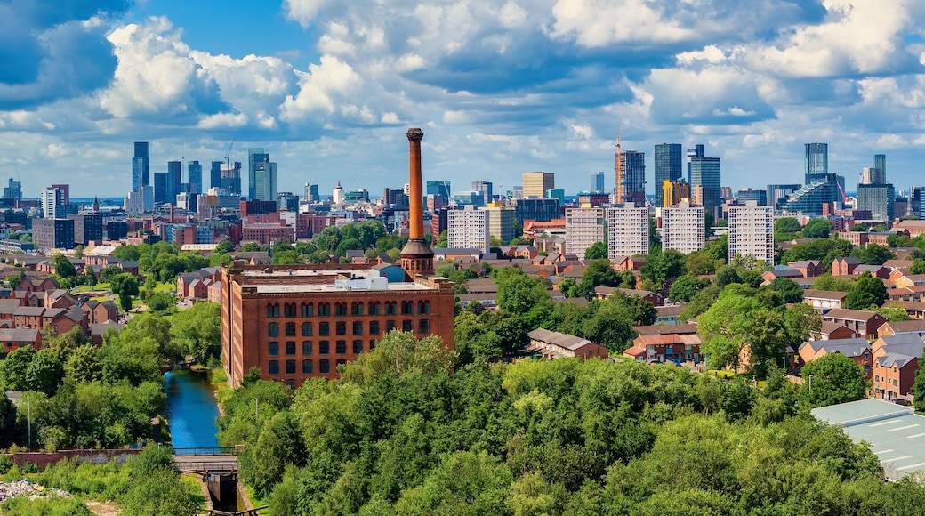 Panoramic View of Manchester Skyline showing old warehouse and chimney.