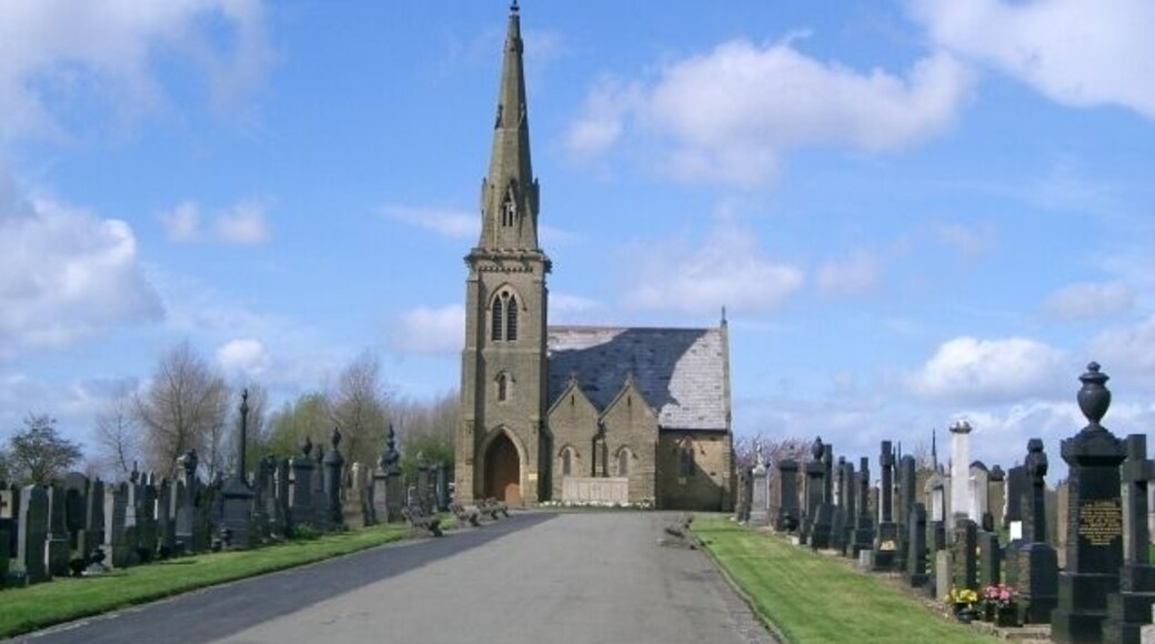 View north along the main drive of Droylsden Cemetery, Greater Manchester, to the mortuary chapel
