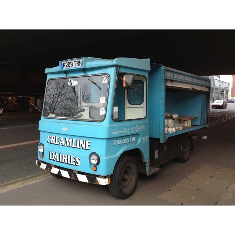 Electric milk float still in service. You don't see many of these around nowadays. 