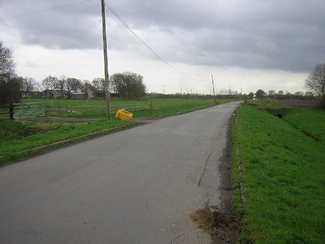 Rindle Road, Astley Moss. Looking south across the flatness of Astley Moss, Rindle Road is the main access point from the north into Chat Moss. On the right is a drainage ditch.