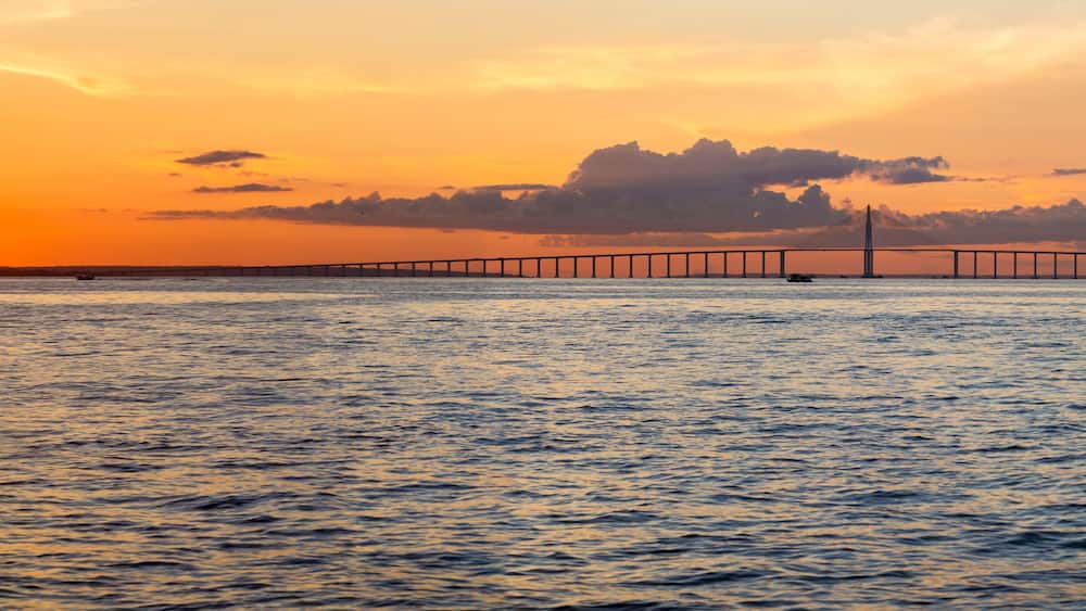 Sunset and Manaus Iranduba Bridge over the Amazon, Brazil