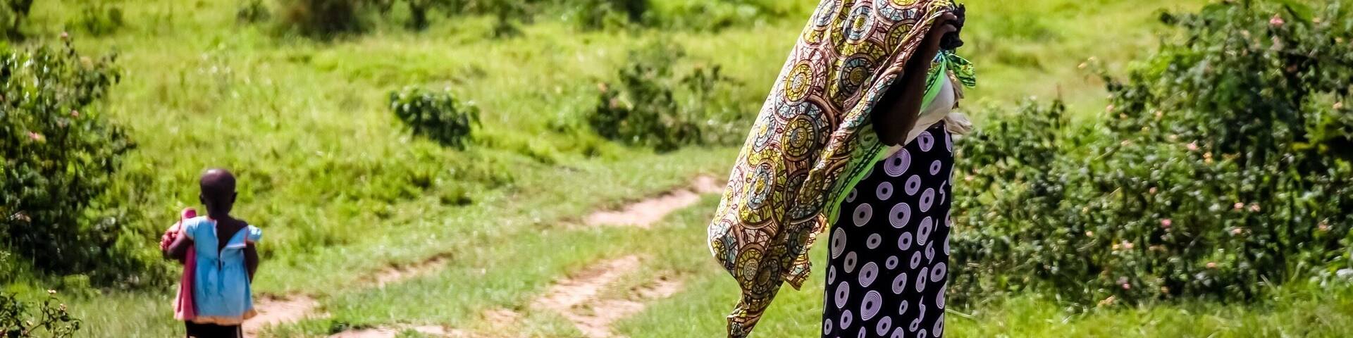 Whilst on a trip to Uganda visiting a rural community watching an NGo drilling for fresh water, I watched a lady beautifully dressed and her child walking along a road on their way home.
_____________________
Mbarara ~ Uganada Africa