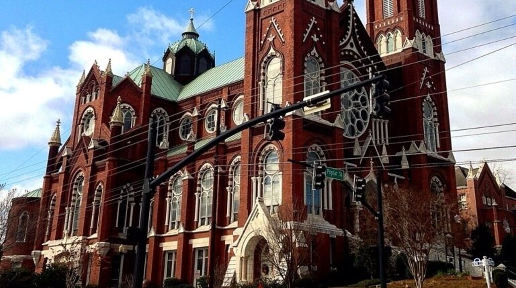 The history of Roman Catholicism in Macon dates to a visit in 1829 by Bishop John England of the Diocese of Charleston and the subsequent migration of Irish Catholic families in the 1830s. In 1841, Macon's Catholics received their first pastor, Father James Graham. A succession of buildings and sites was purchased and used by Macon's Catholics during the nineteenth century, until the construction of St. Joseph's Catholic Church at this location from 1889-1903. This Gothic Revival structure, designed by Brother Cornelius Otten, features a domed cupola, flying buttresses, stained-glass windows from Bavaria, and a high altar of Carrara marble.