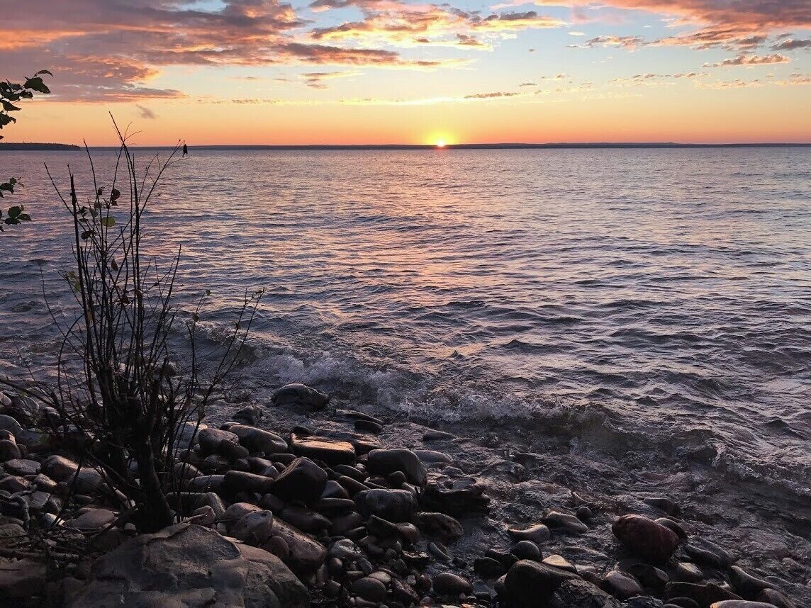 Sunset over Lake Superior in Michigan's Upper Peninsula, taken from my parents' #beach while visiting my markets. The rugged beauty of the UP is not to be missed! #LifeatExpedia
