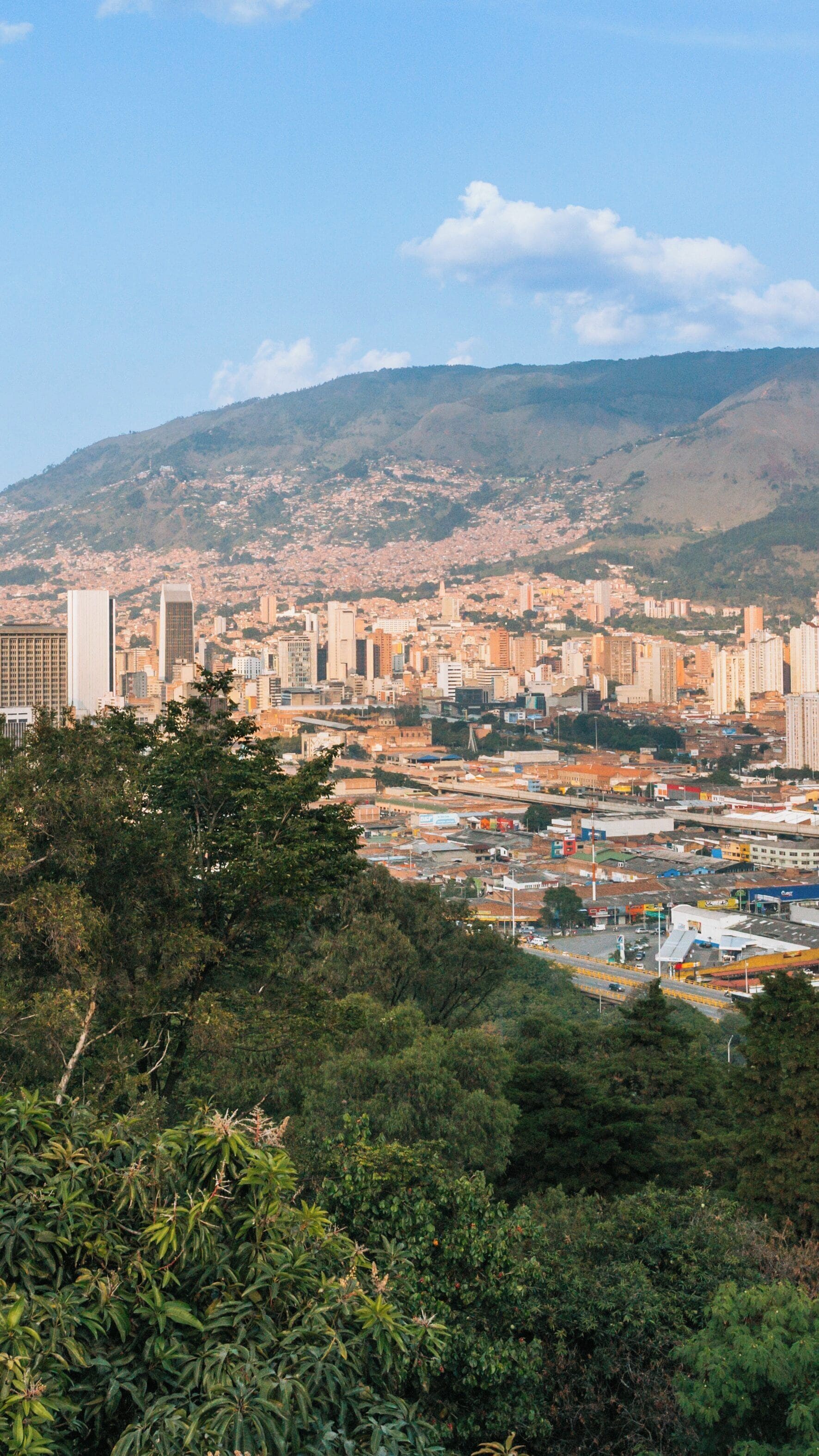 Viewpoint overlooking Pueblito Paisa and Medellin's skyline in Antioquia, Colombia during a sunny day
