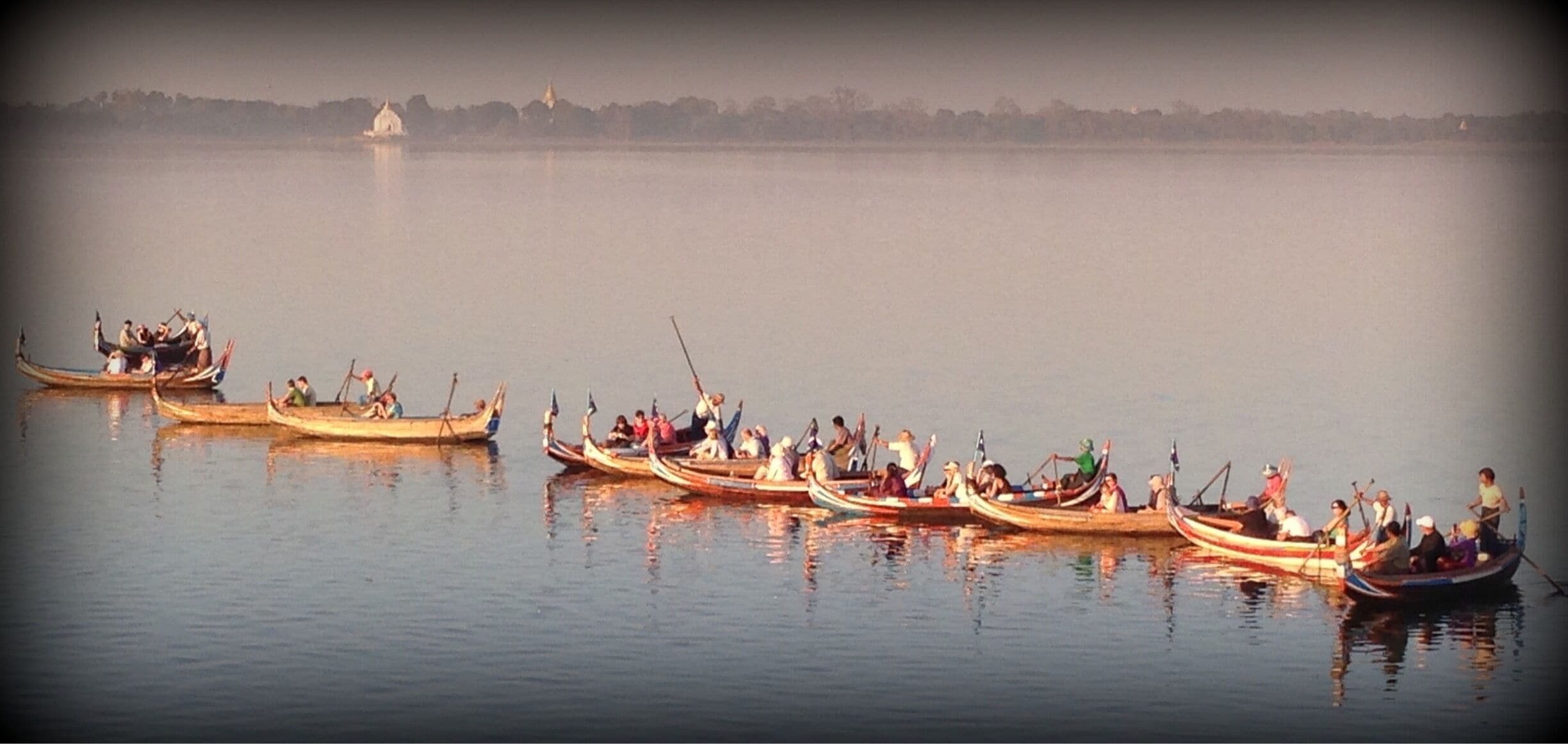Boats chartered to take photographers out to snap pics of the U Bain bridge at sunset. (A similar photo is on the Lonely Planet Myanmar guide.) In dry season, an exposed sandbar allows foot access to a vantage point just as good as those sought by the boats. #GoldenHour 