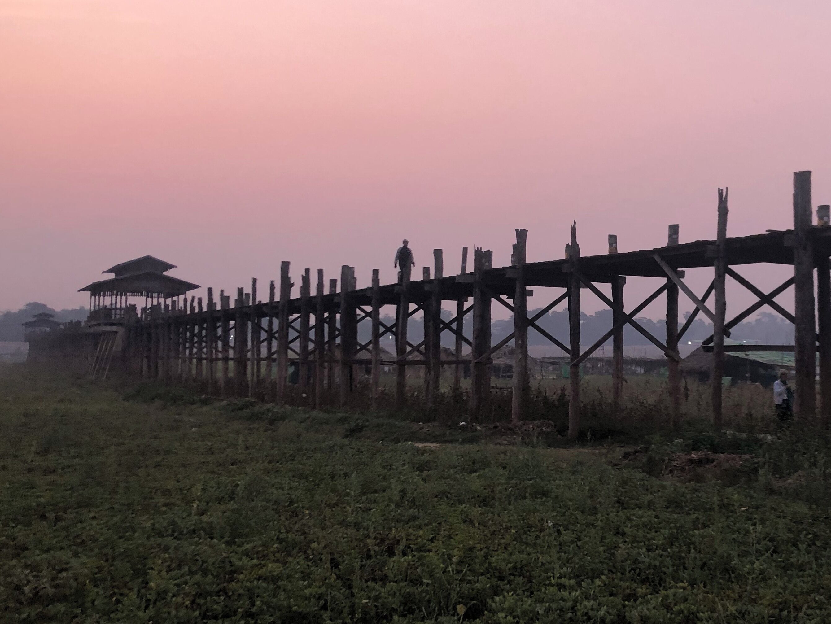 Sunrise on U Bein Bridge. If you get off the night bus from Inle Lake you can get a tuk tuk to the bridge and watch the sun go up as the monks walk to and from on their daily activity.