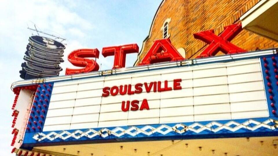 A theater marquee with the words "STAX" and "SOULSVILLE USA" on a brick building.