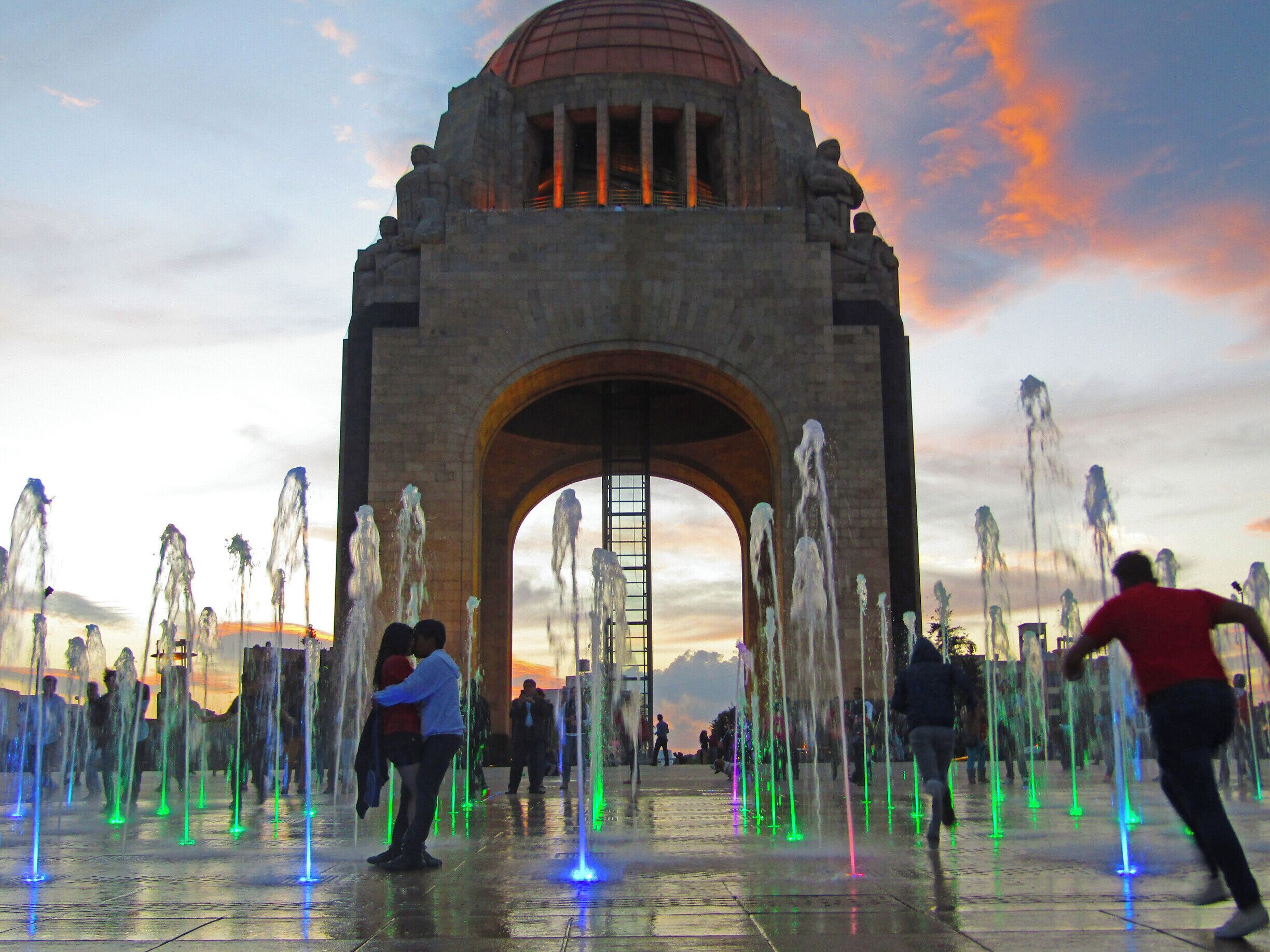 At night, the fountain in front of the Monument to the Revolution is lit up, tempting kids and young lovers to dash through it.