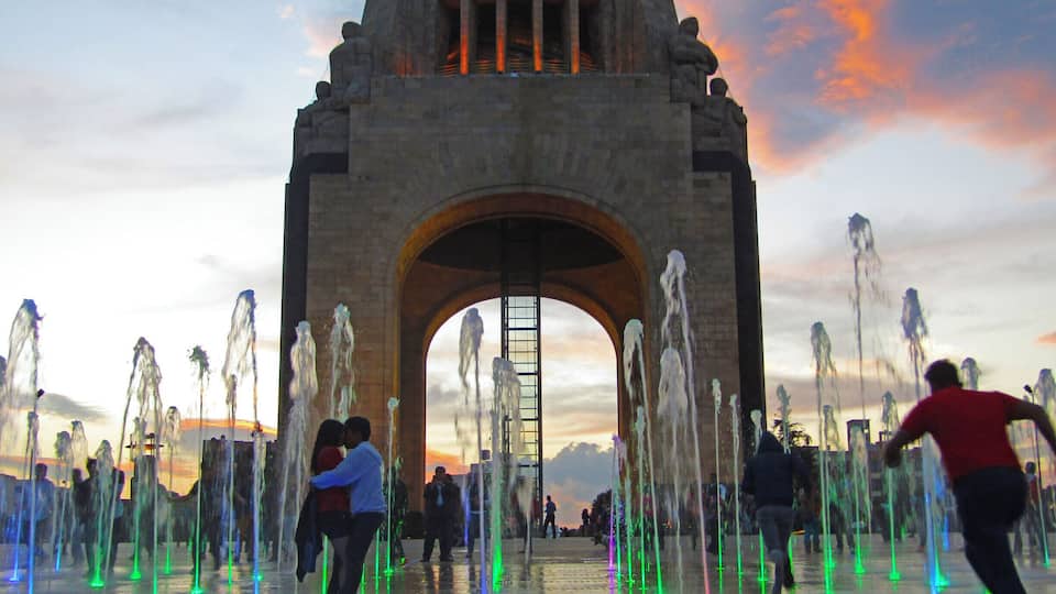 At night, the fountain in front of the Monument to the Revolution is lit up, tempting kids and young lovers to dash through it.