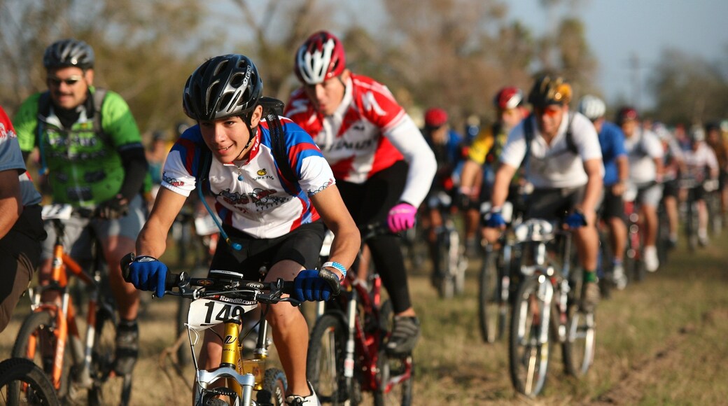 McAllen featuring mountain biking and a sporting event as well as a large group of people