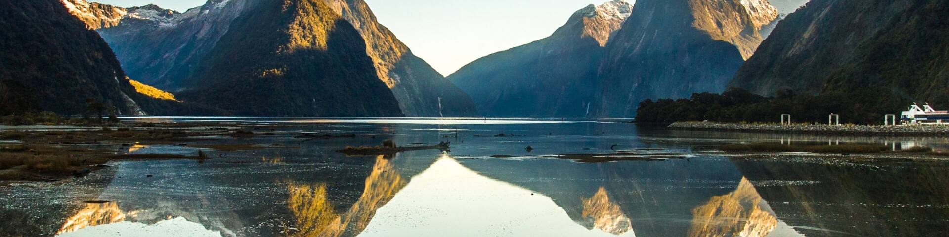 Milford Sound showing mountains and a river or creek