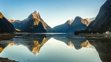 Milford Sound showing a river or creek and mountains