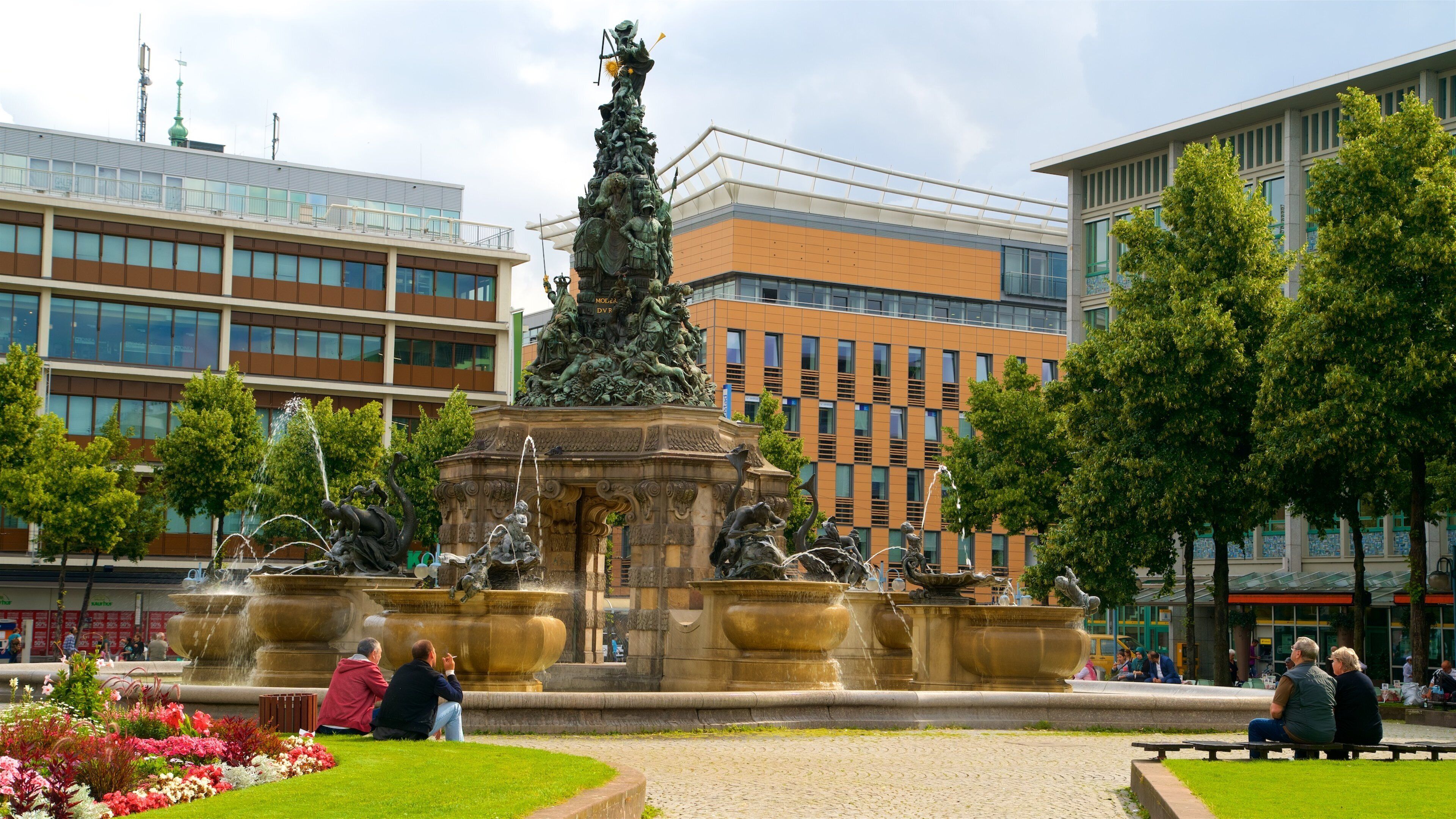 Mannheim featuring a statue or sculpture, a park and flowers