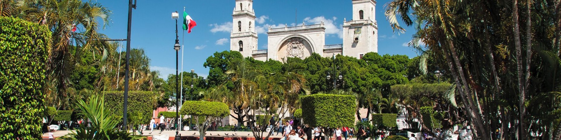 The Plaza de la Independencia (or Plaza Grande) is the bustling central square of the city of Merida, Mexico. The tree-filled plaza is lined with benches, making a great place to meet people. The square is bordered by colorful, colonial-style buildings, with the prominent, fortress-like Catedral de San Ildefonso on the northeast corner.