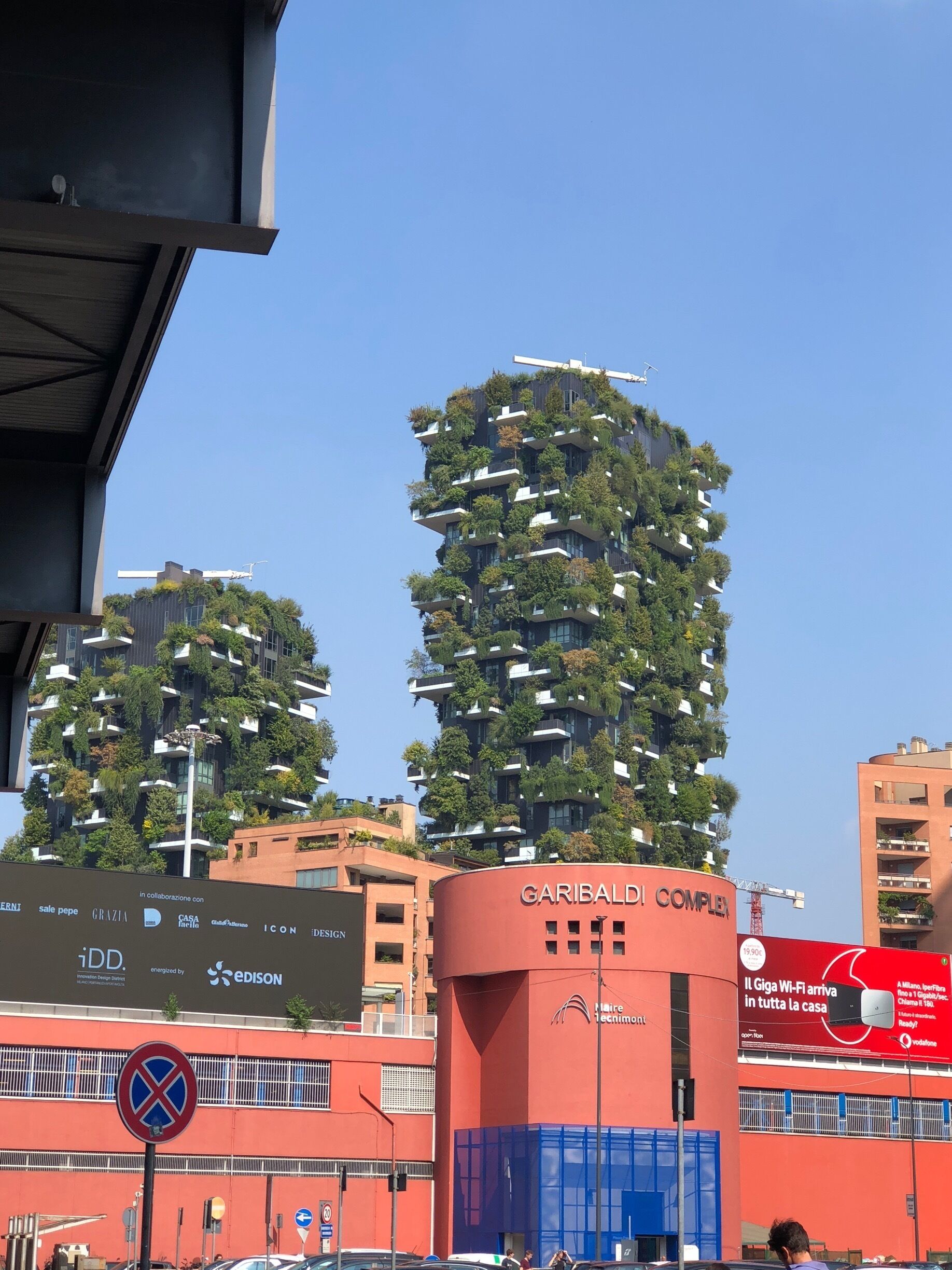 Residential apartment building in Milan, Italy. Contains numerous trees, shrubs and flowers. (09/2018)