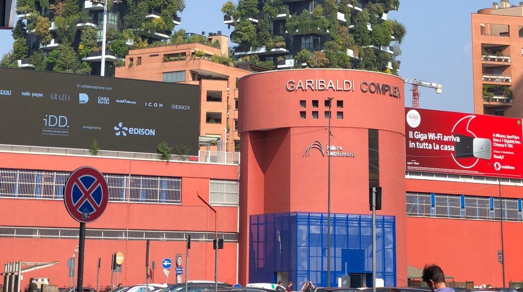 Residential apartment building in Milan, Italy. Contains numerous trees, shrubs and flowers. (09/2018)