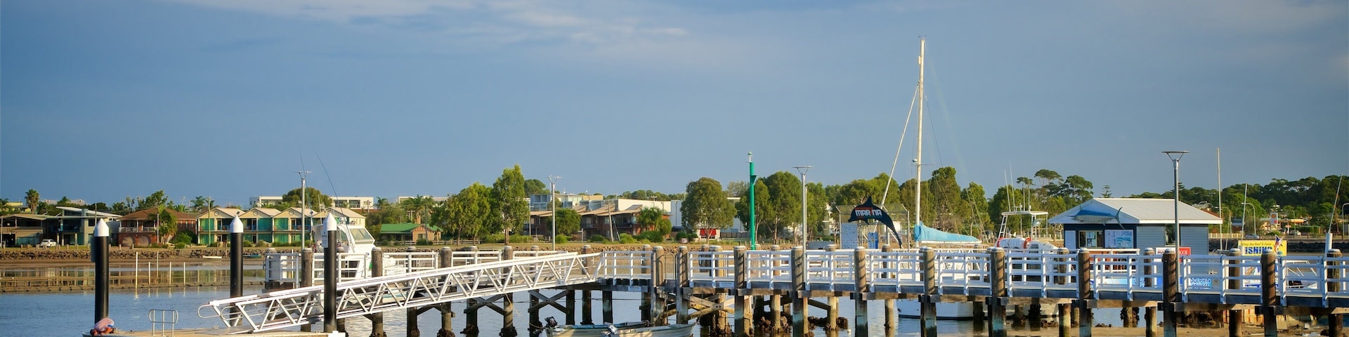 Sapphire Coast which includes a sandy beach and a bay or harbor