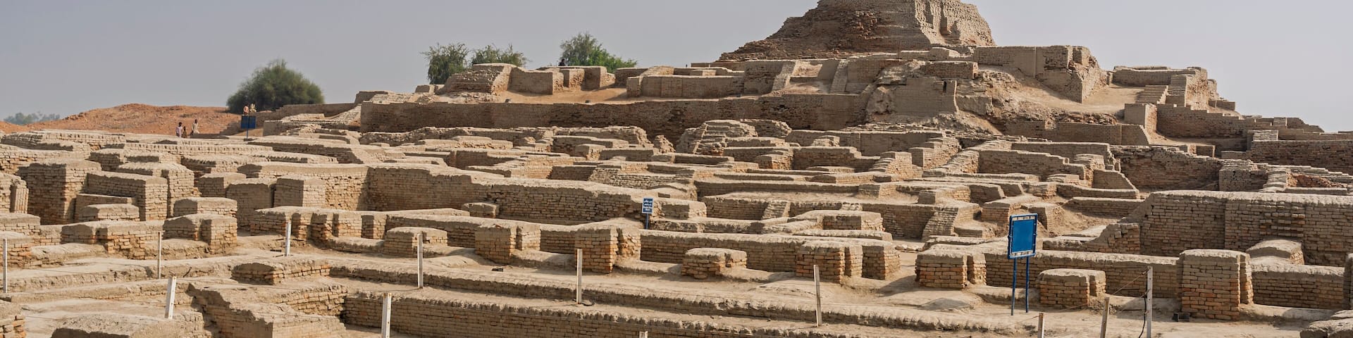 Landscape view of great bath and citadel mound with buddhist stupa in archaeological ruins of UNESCO World Heritage Mohenjo-Daro, Larkana, Sindh, Pakistan