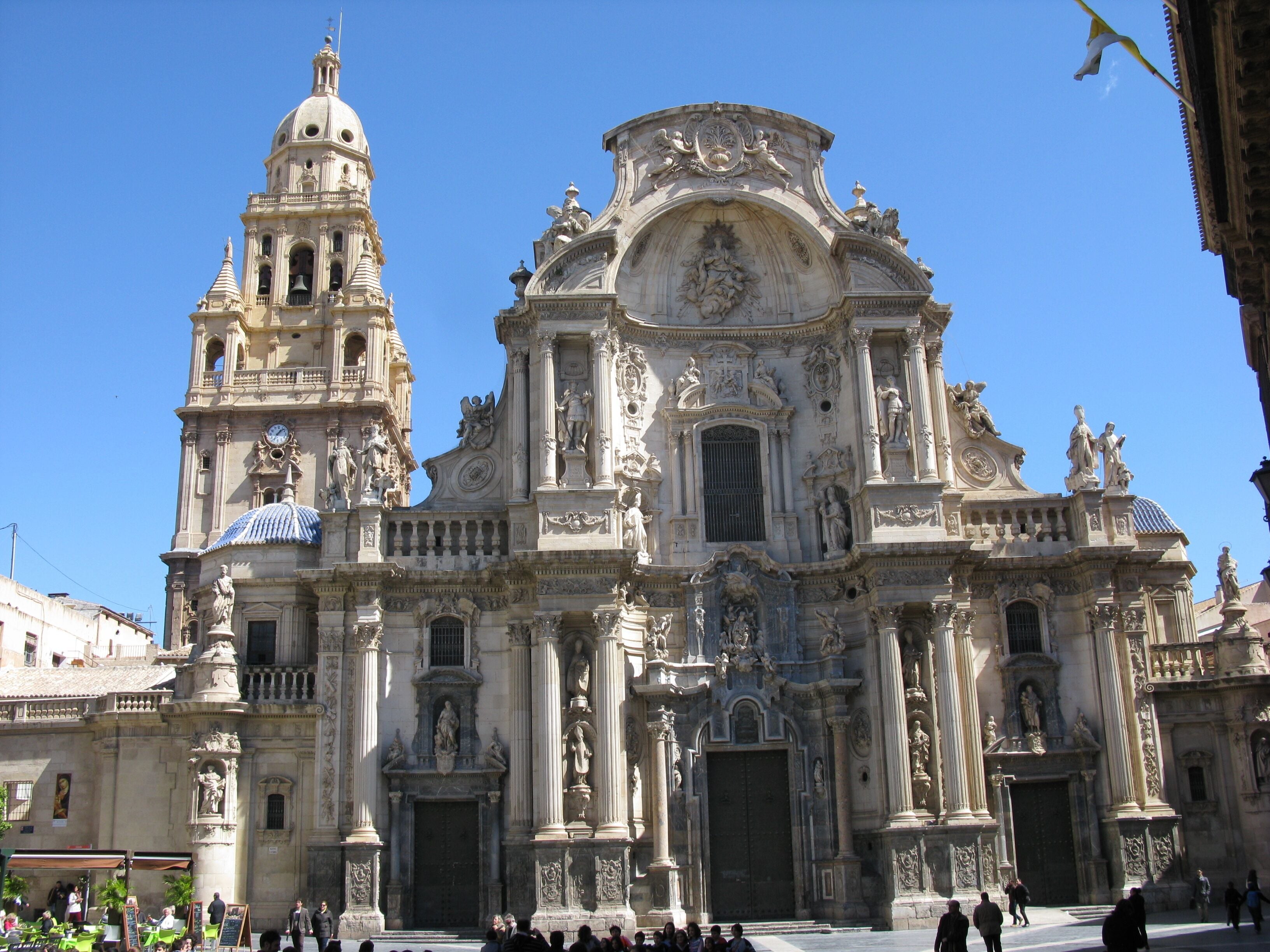 A grand, ornate cathedral with intricate sculptures and a prominent bell tower.