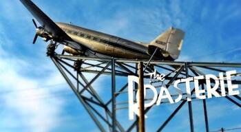 The Roasterie is a specialty coffee-roasting company that services espresso bars, coffeehouses, restaurants, high-end grocers, and coffee Connoisseurs around the world.
the coffee is air-roasted, which helps highlight the origin flavor while unlocking the best of the bean. This is done in house and you get to see it on the tour!
The Roasterie imports only 100 percent Arabica Specialty Grade coffees from
thirty-one different coffee-producing countries.
This company began in 1993, and the plane on top of the building shows off its "air roasting". You can get tours, tastings, or just sit and relax on the deck. It's a lot more chill then any other coffee house, and has great coffee!