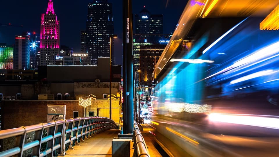 There is an overpass that has a great view of the city and there metro/rail system has a car that runs on the overpass. Under the overpass are a set of four or five train tracks for other cool shots. Great spot for sunset and night shots. If you get dropped off at the Jack Stack restaurant and walk around toward the far end of the parking lot, past the other restaurants there, you will find a set of stairs to bring you to the overpass.