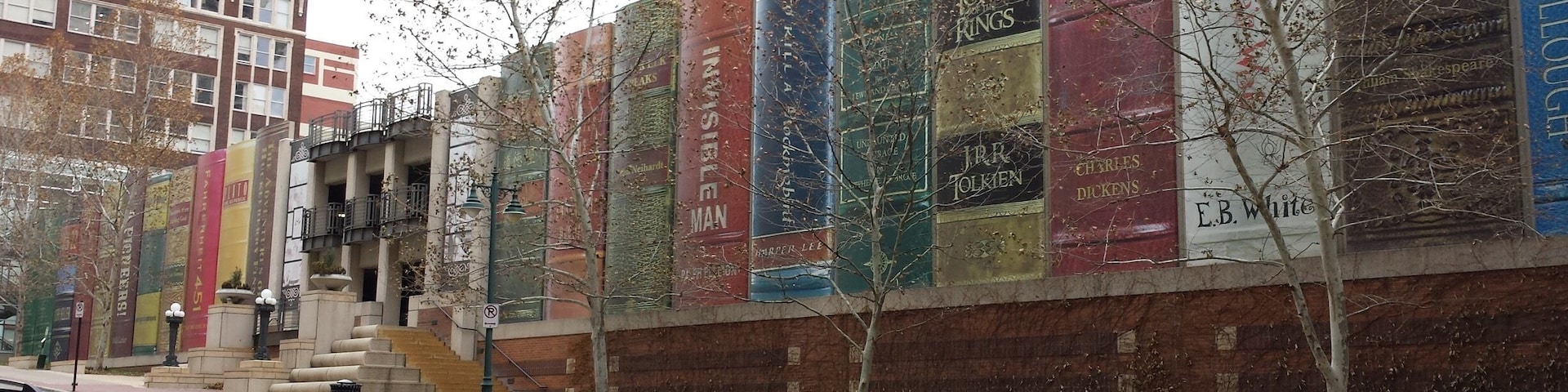 You wouldn't know it until, like me, you walked up and investigated it; but what lies behind the wall of giant books is a simple parking garage. Even the stone steps are a would-be stack of books.